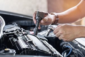 Close,Up,Spark,Plug,Coil,In,Hand,A,Man,And - Meineke Wisconsin Meineke Car Care | Ignition Coil | Sheboygan